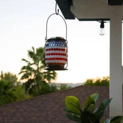 7" Solar Patriotic Glass/Iron Hanging Lantern With LED Lights Cool White - Alpine Corporation
